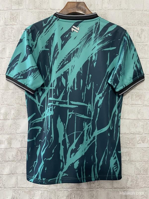 25/26 Tipperary GAA Teal with Warrior Silhouette and Abstract Brushstroke Pattern Jersey